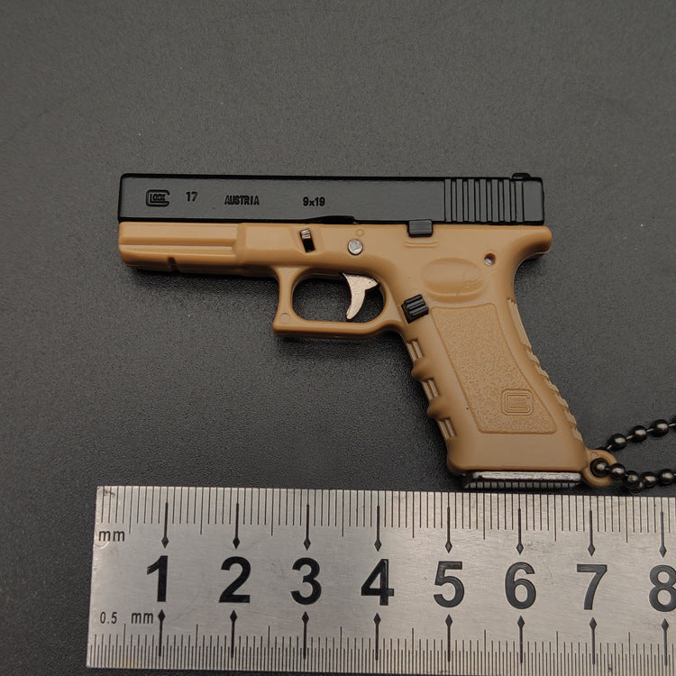 Miniature Gun Keychain That Fully Disassembles