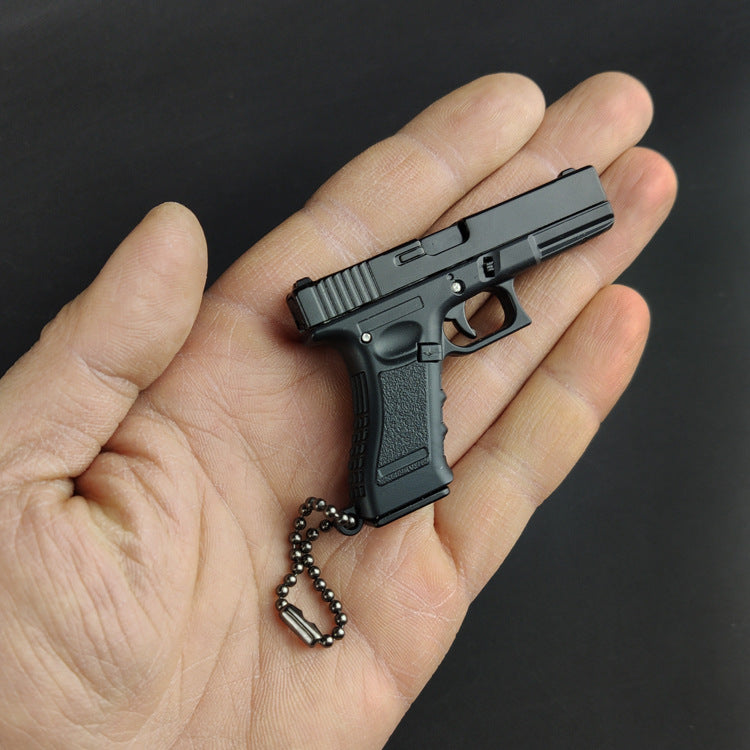 Miniature Gun Keychain That Fully Disassembles