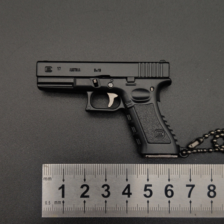 Miniature Gun Keychain That Fully Disassembles
