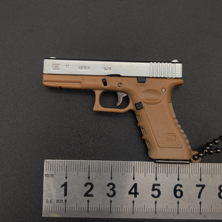 Miniature Gun Keychain That Fully Disassembles
