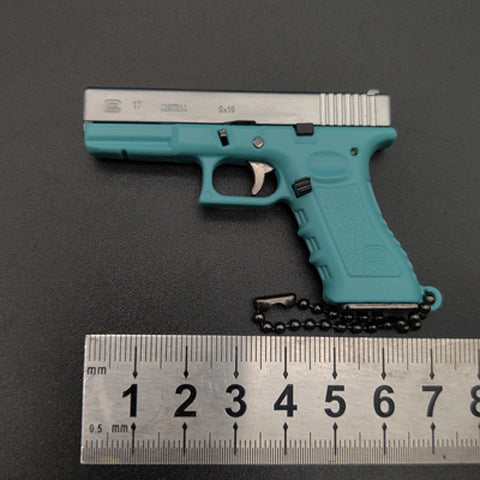 Miniature Gun Keychain That Fully Disassembles