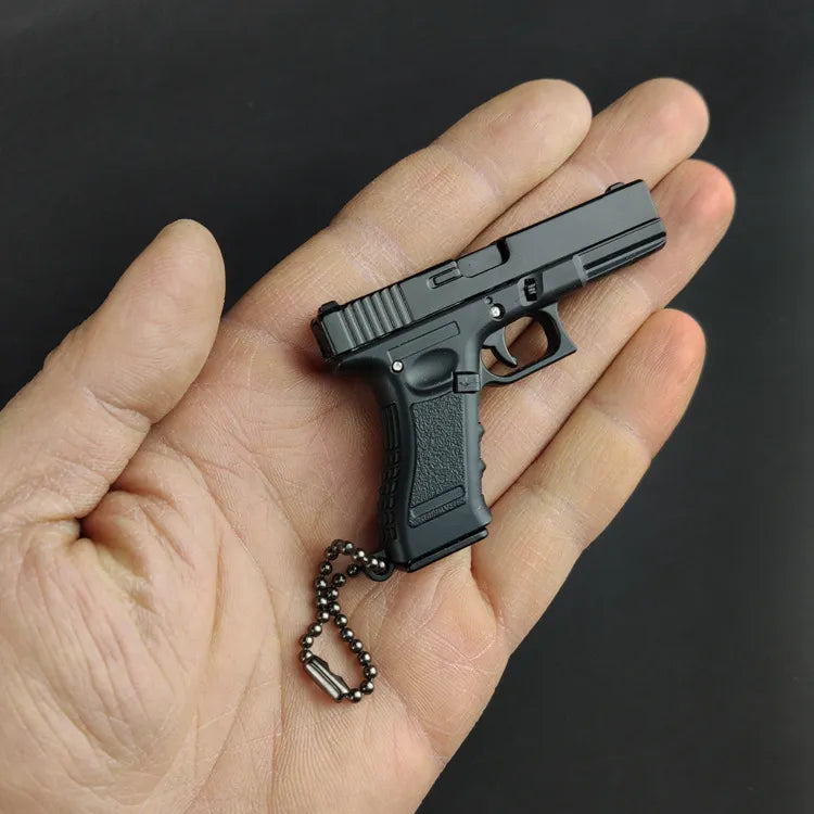 Miniature Gun Keychain That Fully Disassembles