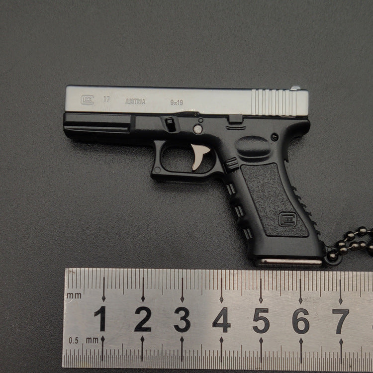 Miniature Gun Keychain That Fully Disassembles